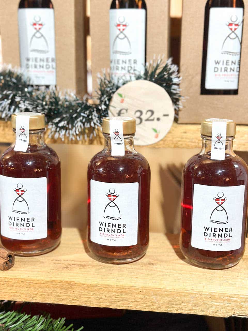 Bottles of Wiener Dirndl fruit liqueur on display at one of the Christmas markets in Vienna