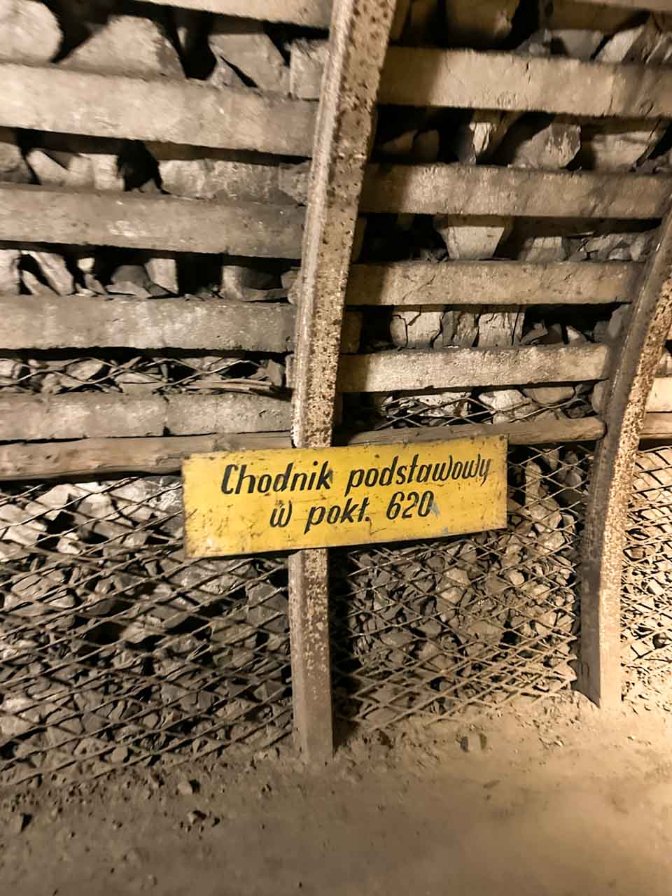 A yellow mining sign inside a tunnel at the Guido Mine in Zabrze, Poland