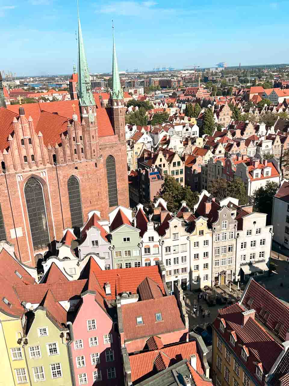 St. Mary’s Church in Gdańsk seen from above, with rows of colourful gabled houses in front of it