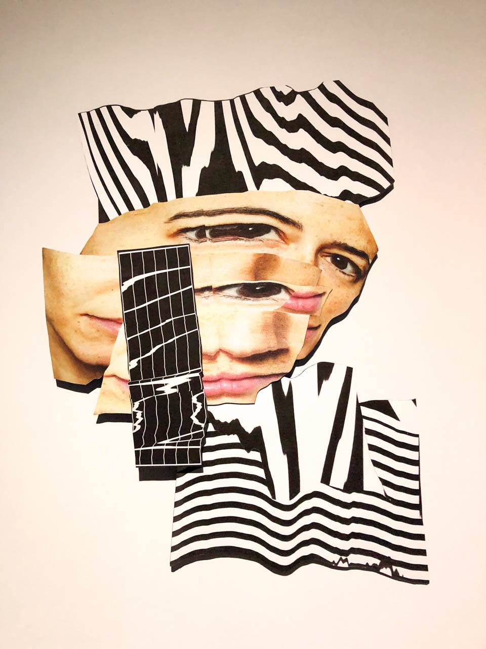 Modern collage artwork featuring distorted facial features and bold black-and-white patterns on display at the Abbots' Palace in Gdańsk