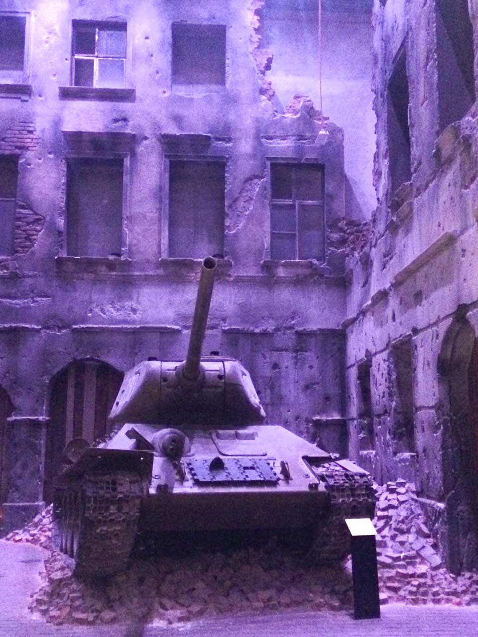 Soviet T-34 tank displayed in a reconstructed bombed-out street at the Museum of the Second World War
