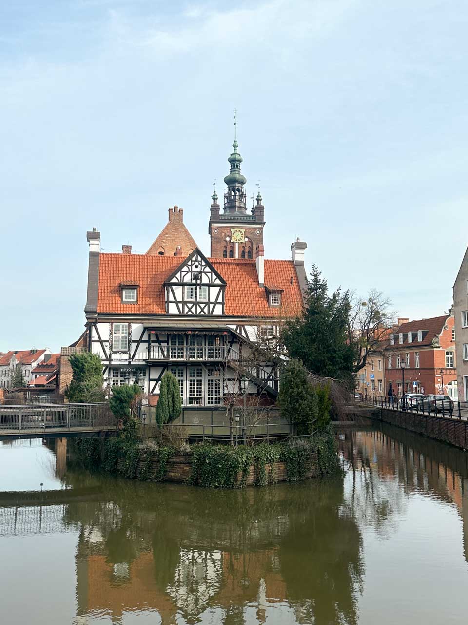 The Millers' Guild House in Gdańsk, a timber-framed building surrounded by water