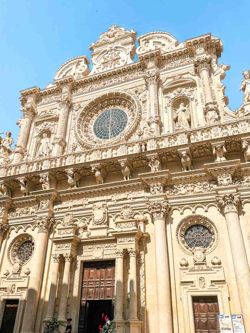 Close-up of the detailed Baroque facade of Basilica di Santa Croce in Lecce