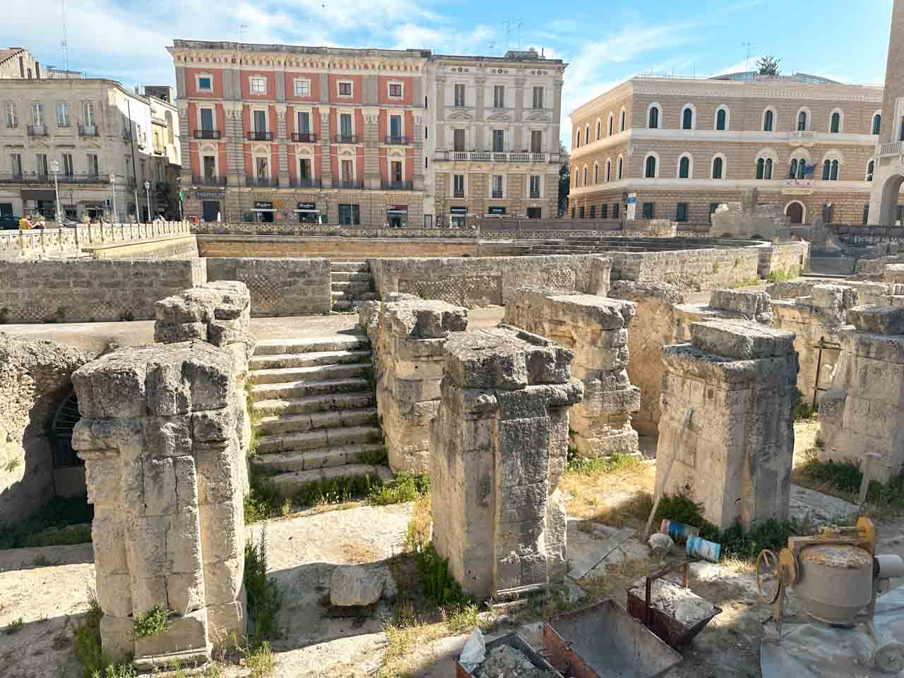 Close view of stone columns and steps of the Roman amphitheatre ruins in Lecce