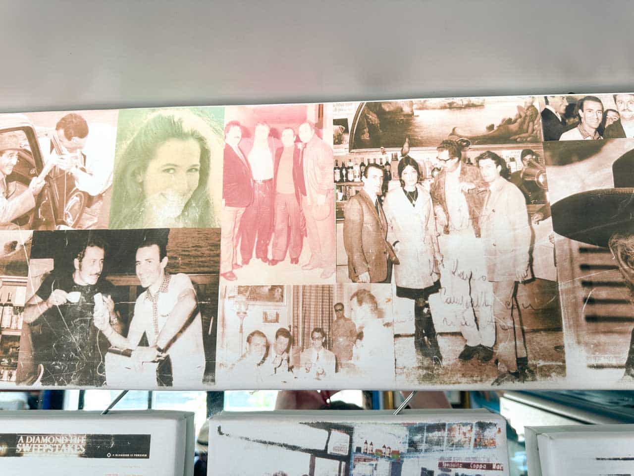A collage of vintage photographs displayed inside Il Super Mago del Gelo Mario Campanella in Polignano a Mare, Italy