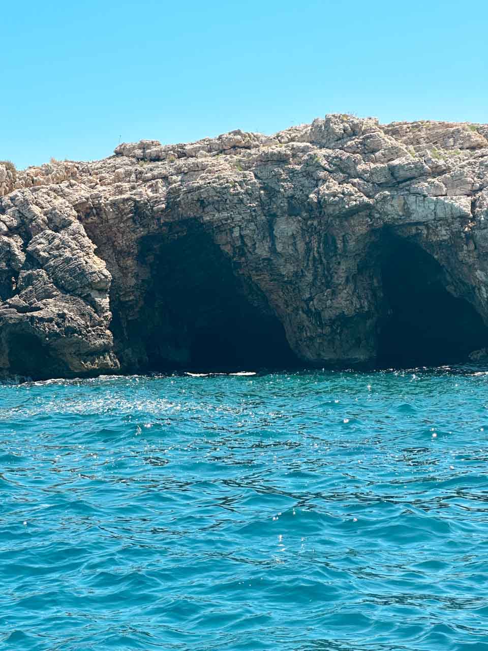 Rocky sea caves along the coastline near Polignano a Mare