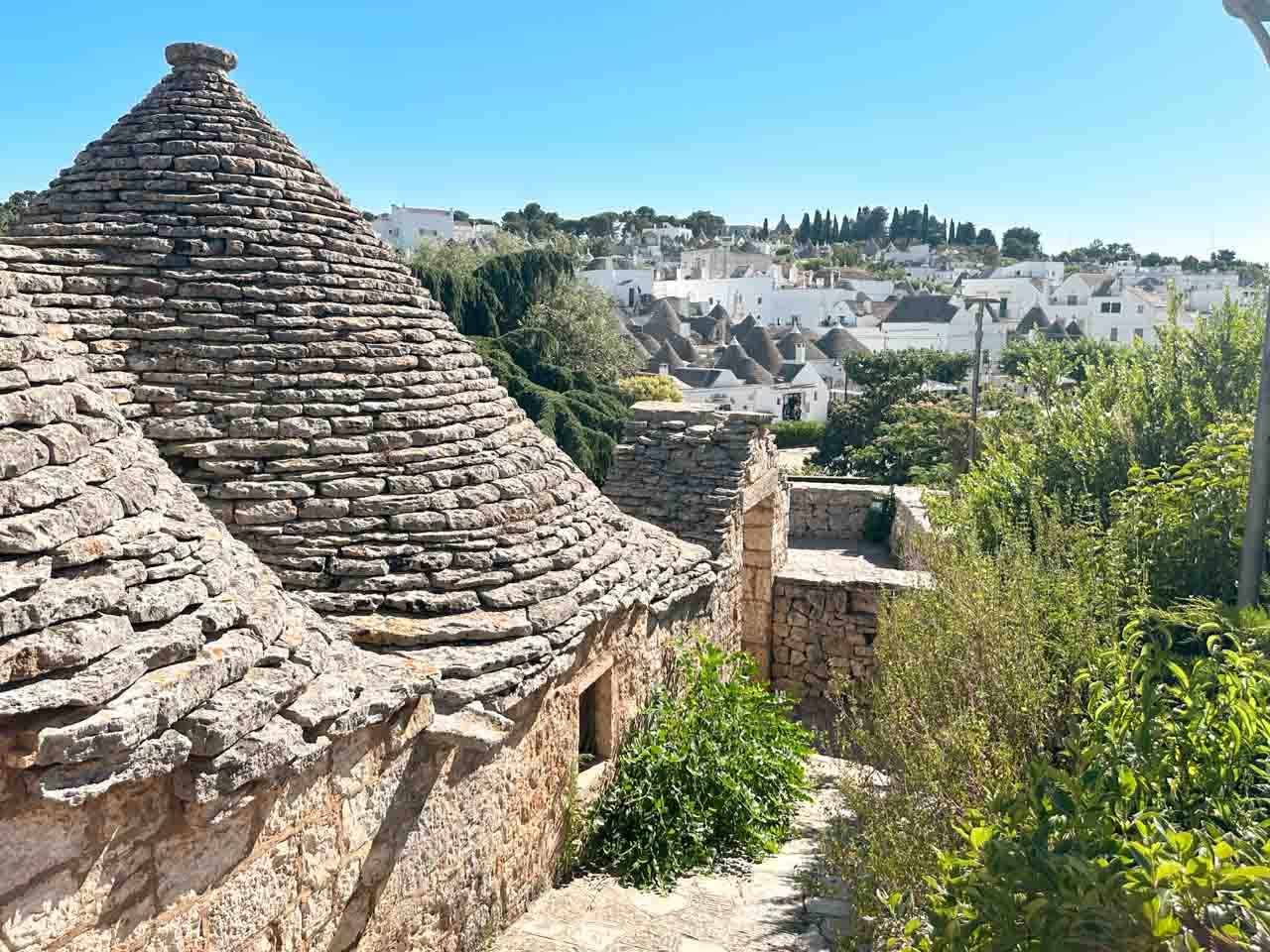 Traditional trullo roof with views across the whitewashed houses of Alberobello