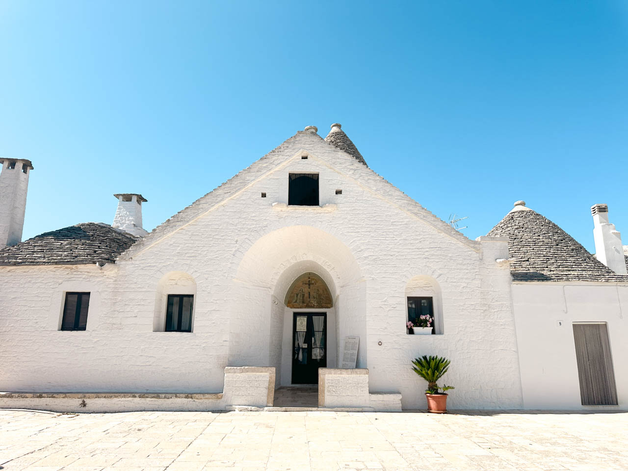 Front view of Trullo Sovrano, the only two-storey trullo in Alberobello