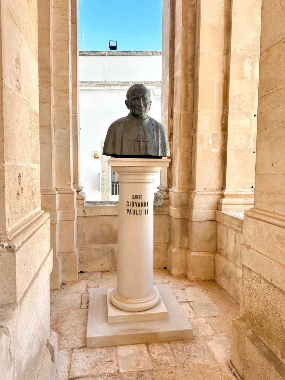 Bust of Pope John Paul II outside the Basilica of Saints Cosmas and Damian in Alberobello, Italy