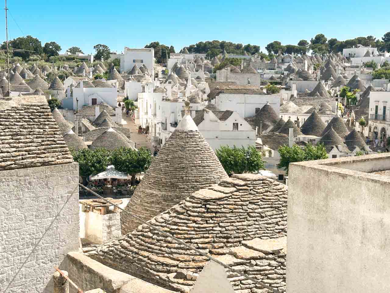 View over the trulli rooftops of Alberobello from a terrace overlooking the historic centre