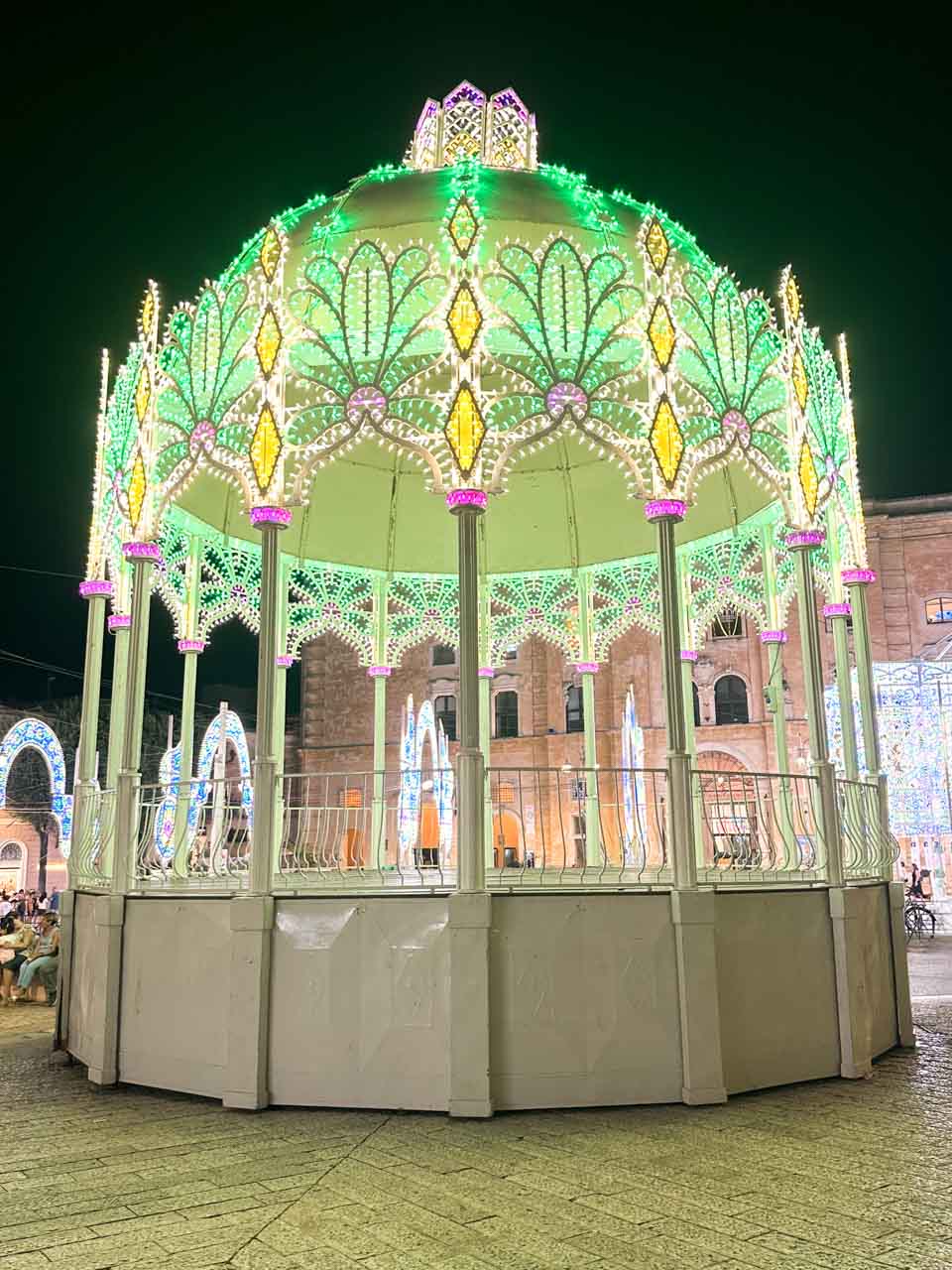 An illuminated bandstand decorated for the Festa della Bruna celebrations in Matera