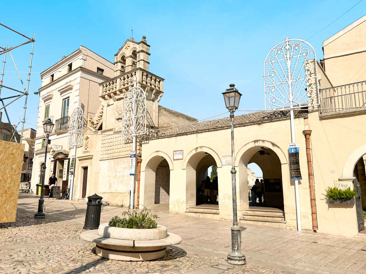 Piazza Vittorio Veneto in Matera with its arched viewpoint terrace and historic buildings on a sunny day