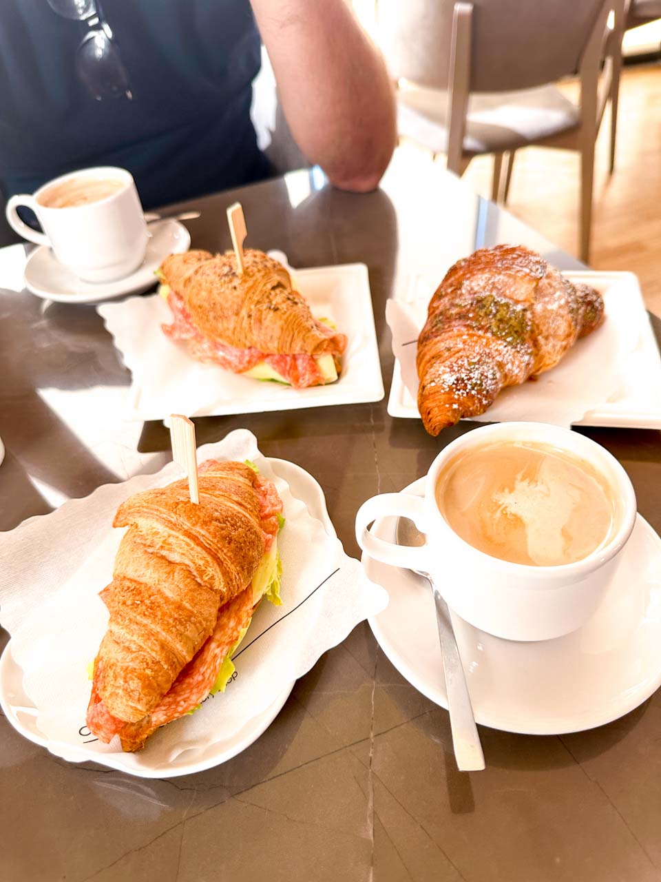 Croissants and coffees served for breakfast at Da Bitonto caf&eacute; in Matera