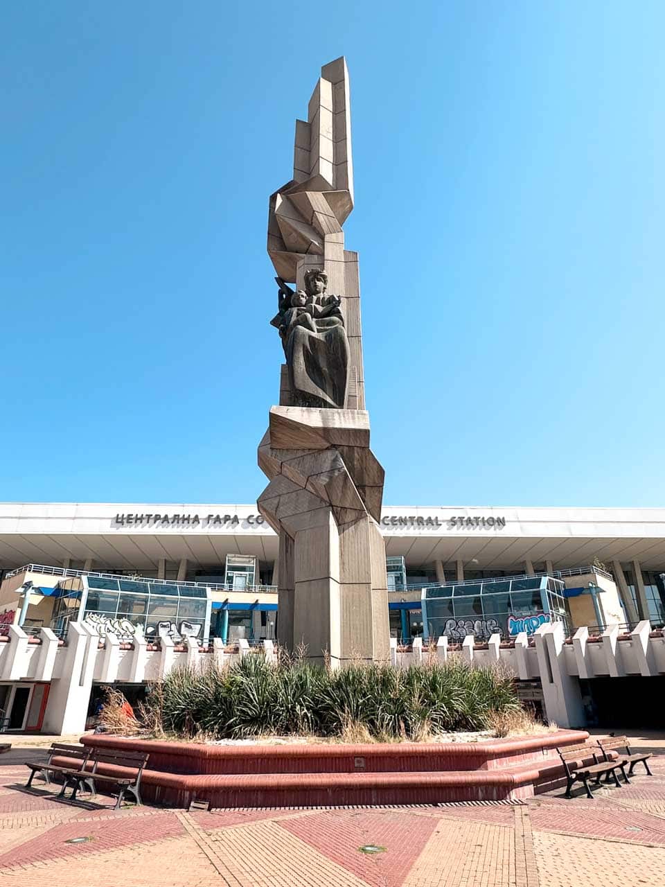 Monument outside Sofia Central Railway Station against a clear blue sky