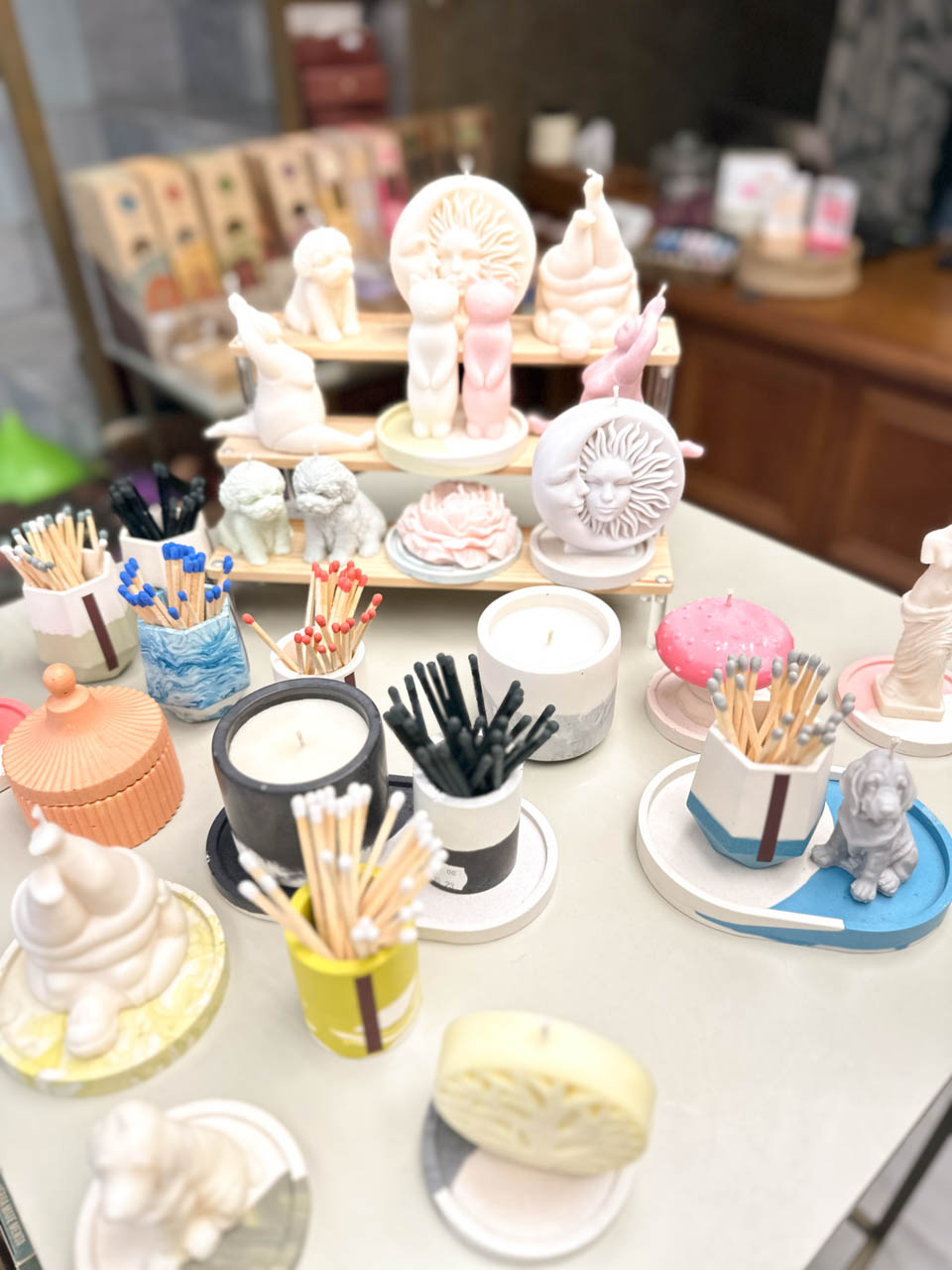 Handmade decorative candles and colourful match holders displayed inside the Uhaya shop in Sofia, Bulgaria