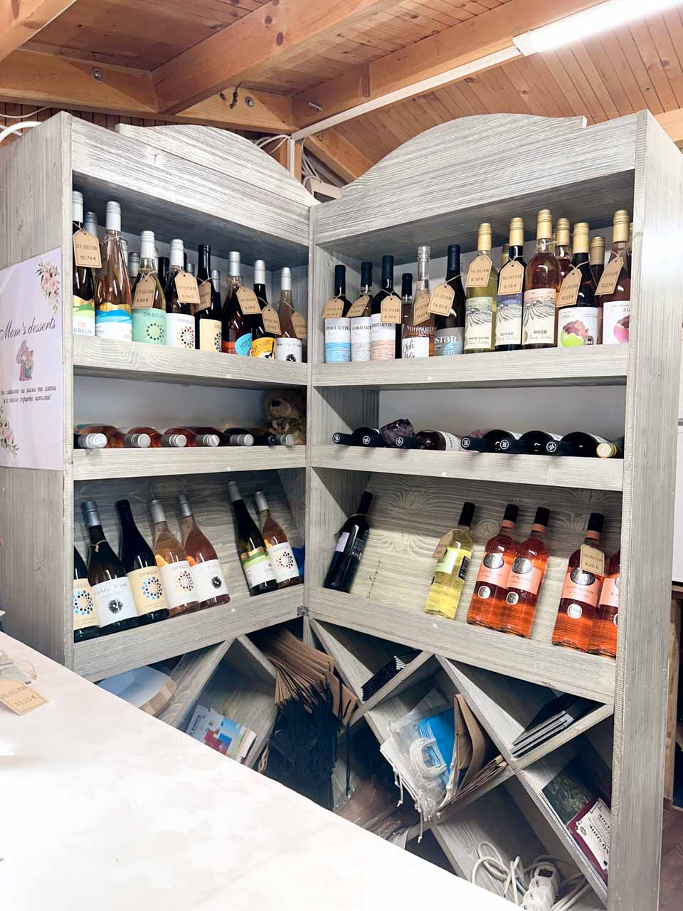 Shelves filled with bottles of Bulgarian wine for sale at a stall in Zhenski Pazar, or Women&rsquo;s Market, in Sofia