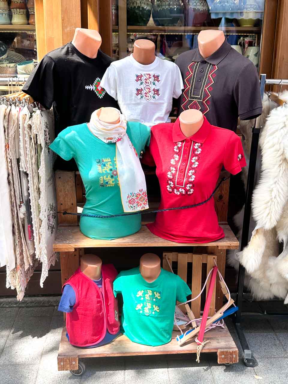 Mannequins wearing colourful clothing with traditional Bulgarian embroidery outside a shop in Zhenski Pazar, or Women&rsquo;s Market, in Sofia