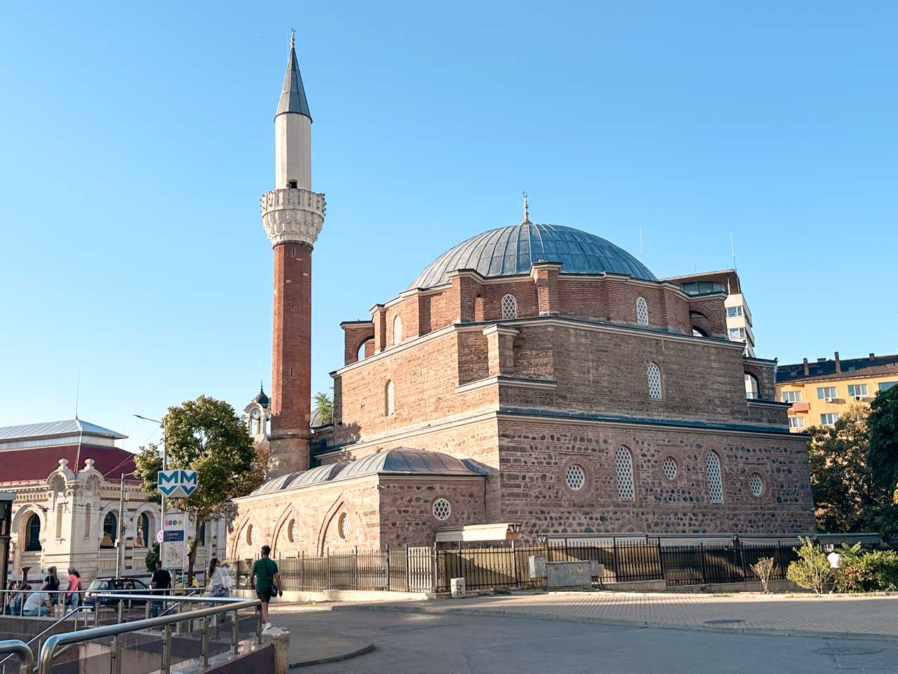 Banya Bashi Mosque in central Sofia, with its large dome and tall minaret against a clear blue sky