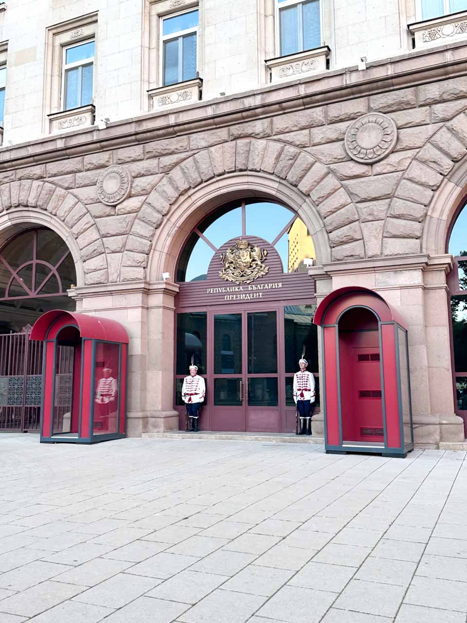 Guards standing outside the entrance to the Presidential Palace in Sofia, Bulgaria, in traditional uniforms