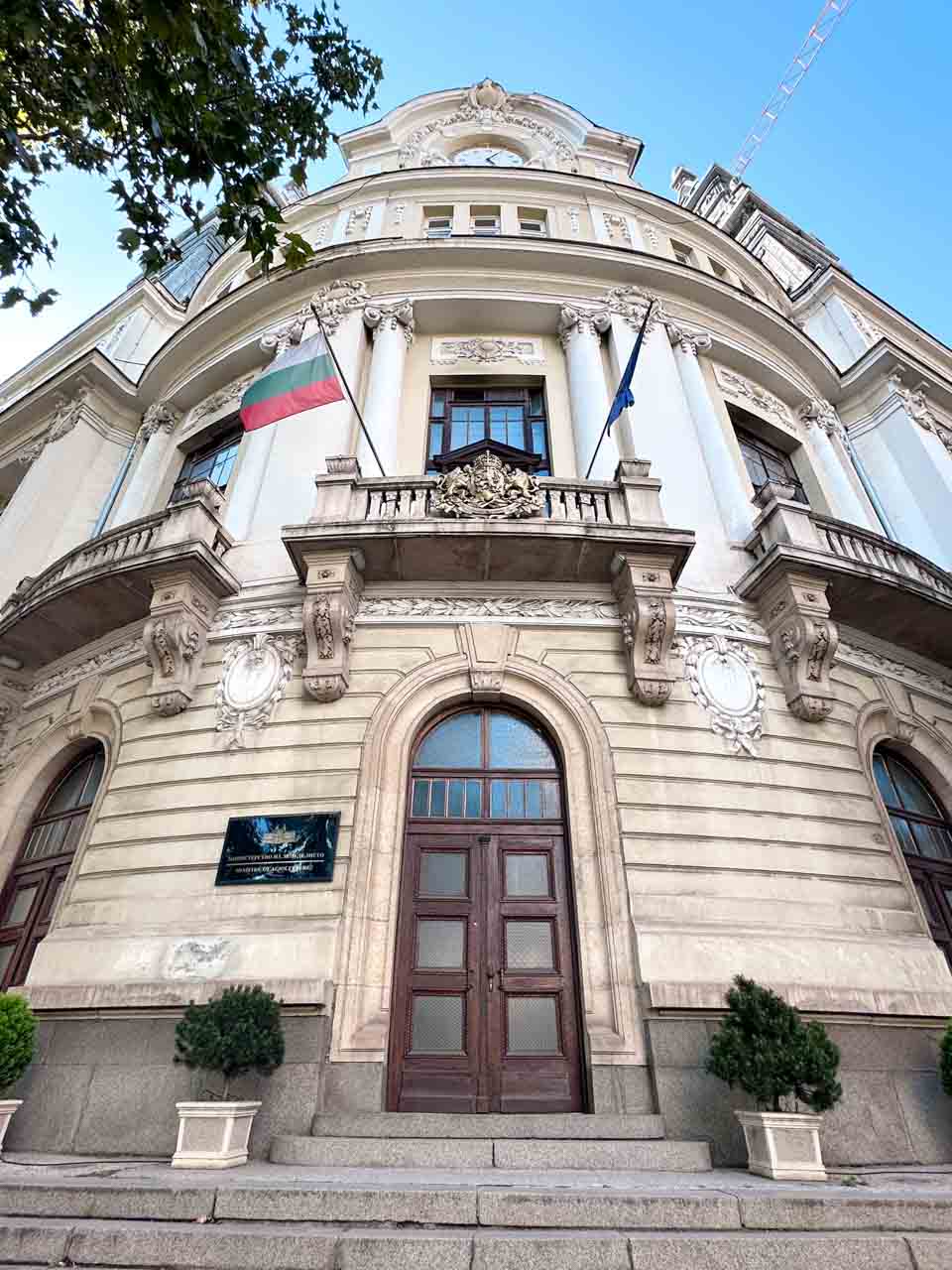 Ornate entrance to Bulgaria&rsquo;s Ministry of Agriculture building in Sofia, with Bulgarian and EU flags above the door