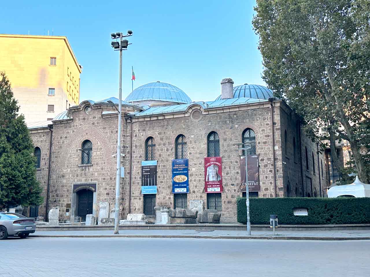 Exterior of the National Archaeological Museum in Sofia, housed in a former Ottoman mosque with domed roofs