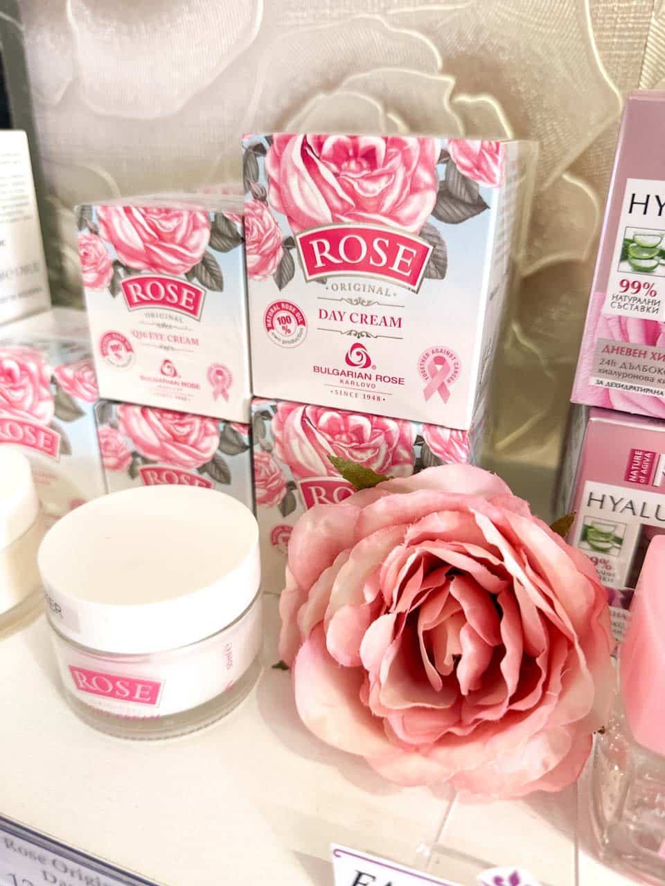 Bulgarian rose skincare products and pink rose display inside the One Bulgarian Rose shop in Sofia