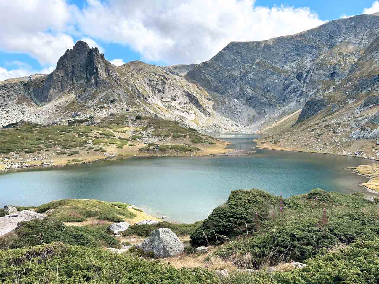 One of the Seven Rila Lakes surrounded by mountain peaks in Bulgaria&rsquo;s Rila Mountains