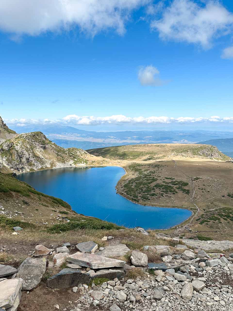 Panoramic view over one of the Seven Rila Lakes and surrounding mountains
