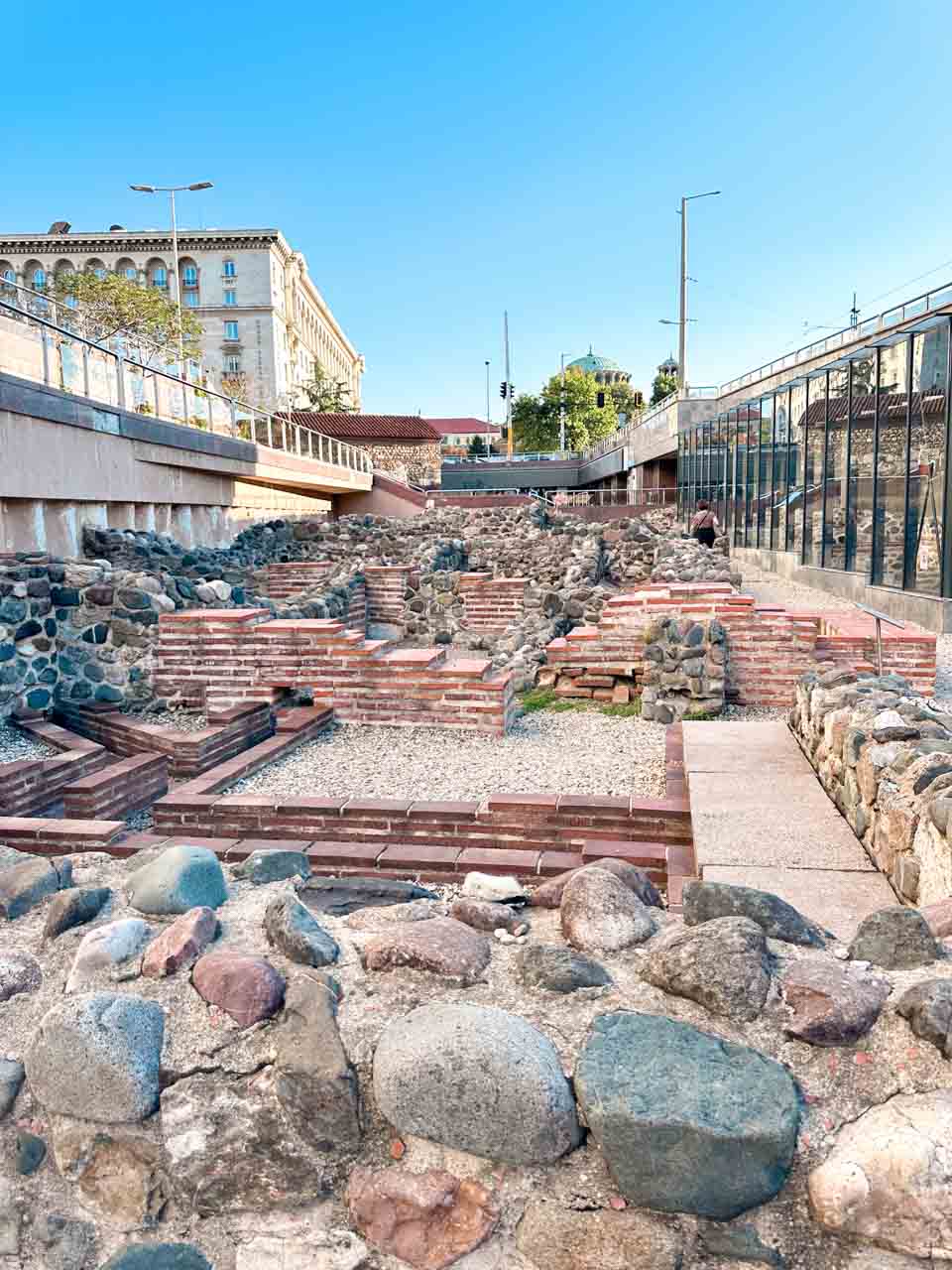 Ancient Roman ruins of Serdica surrounded by modern buildings in central Sofia