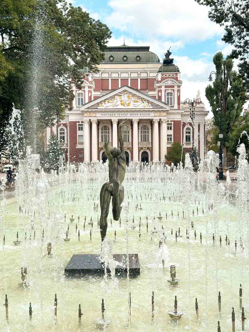 Fountains and a bronze sculpture in front of the Ivan Vazov National Theatre in central Sofia, Bulgaria