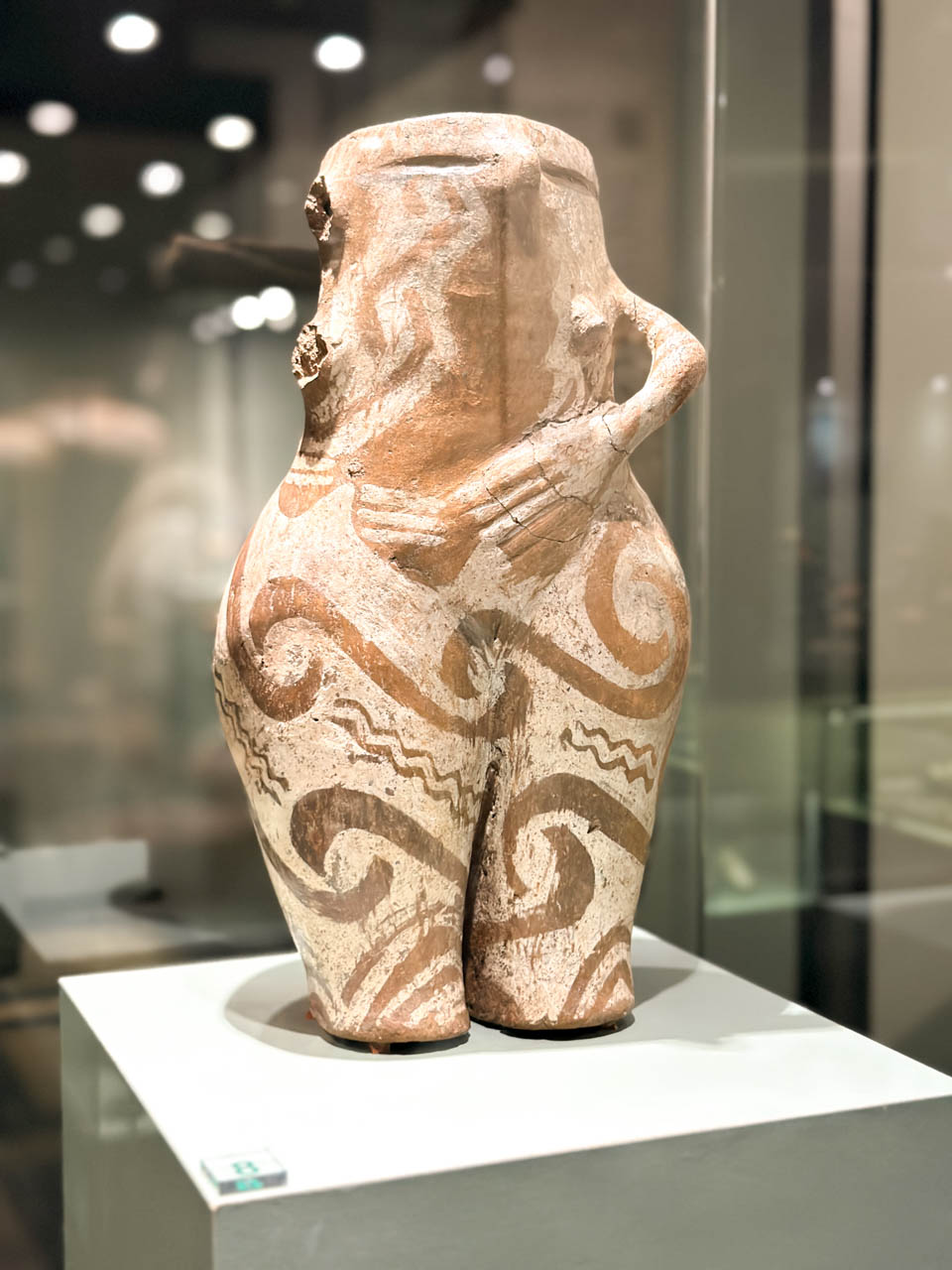 Ancient painted ceramic figurine displayed inside the National Archaeological Museum in Sofia, Bulgaria