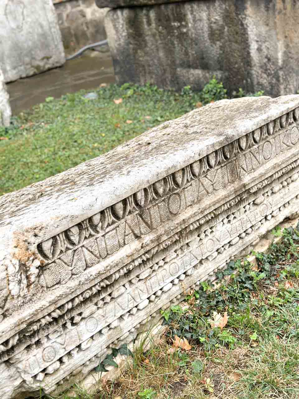 Carved ancient stone with decorative patterns and inscriptions outside the National Archaeological Museum in Sofia, Bulgaria