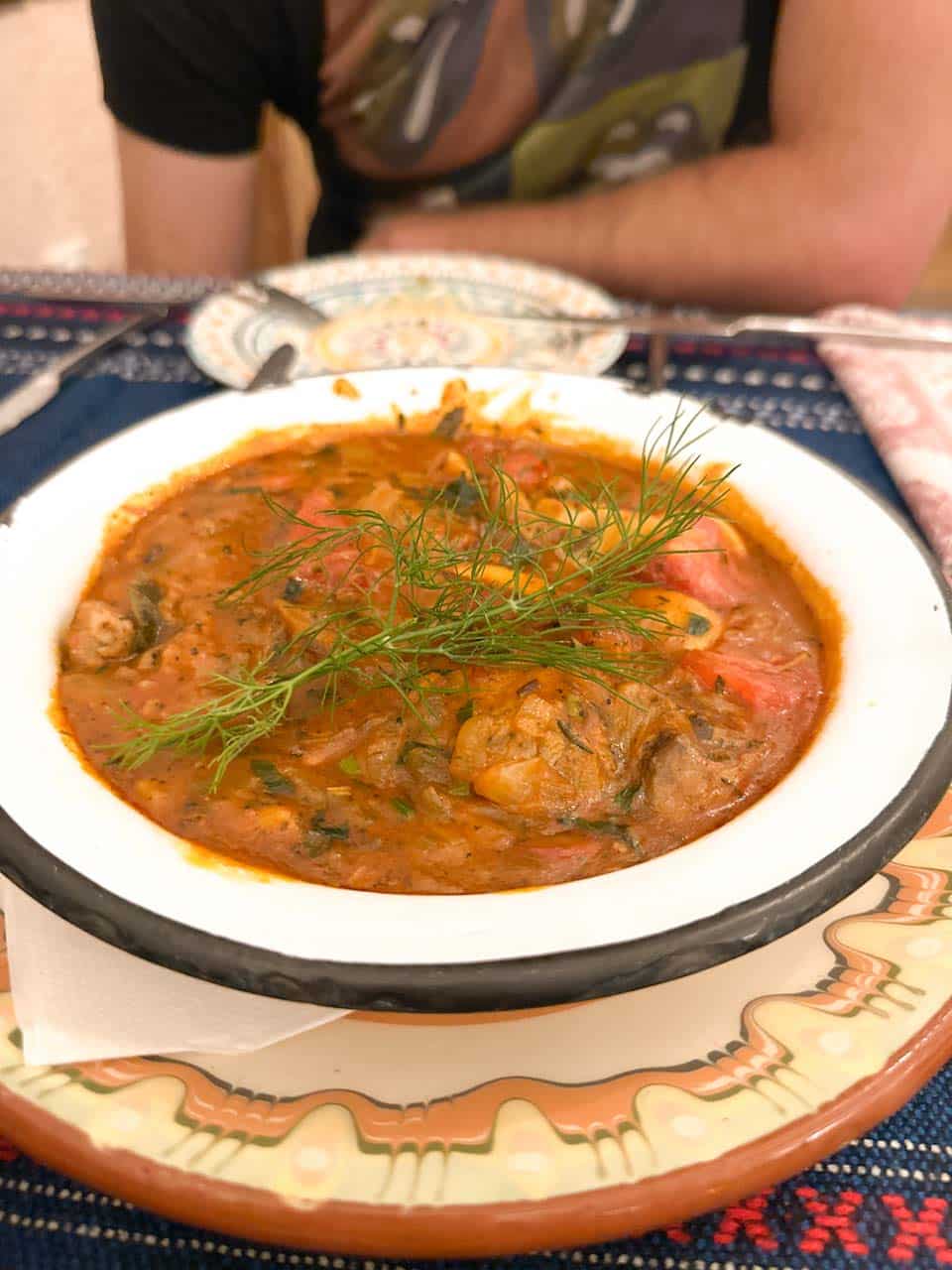 A traditional Bulgarian meat stew served in a ceramic dish at Manastirska Magernitsa in Sofia, Bulgaria