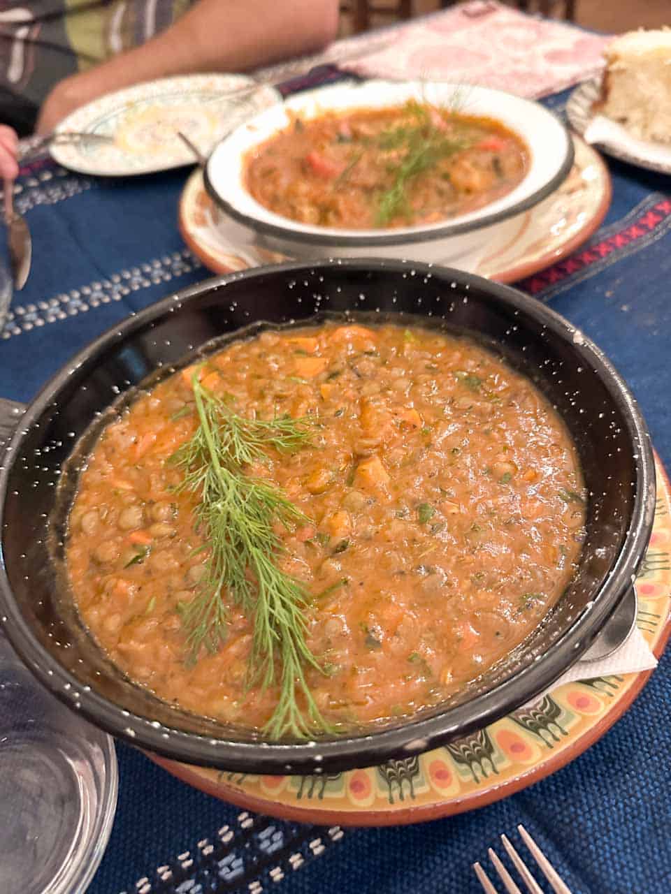 Traditional Bulgarian lentil stew topped with fresh dill at Manastirska Magernitsa in Sofia, Bulgaria