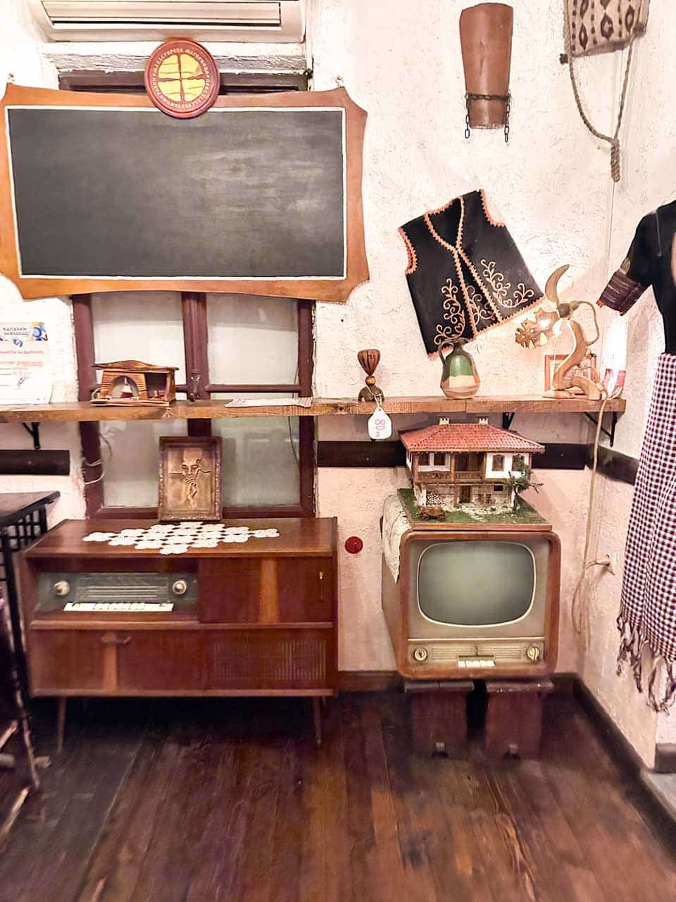Traditional Bulgarian decor with a vintage radio and television inside Manastirska Magernitsa in Sofia, Bulgaria