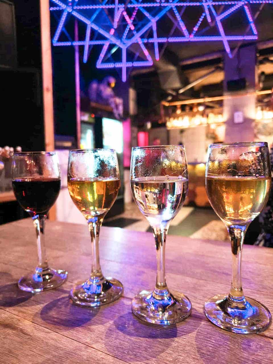 Four glasses of rakia lined up for a tasting at Raketa Rakia Bar in Sofia
