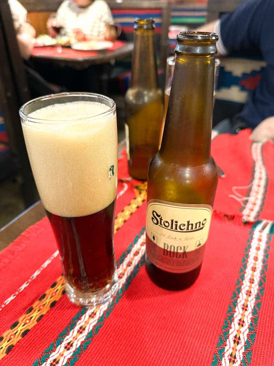 Bottle and glass of Stolichno Bock beer at Hadjidraganov's Cellars Restaurant in Sofia, Bulgaria