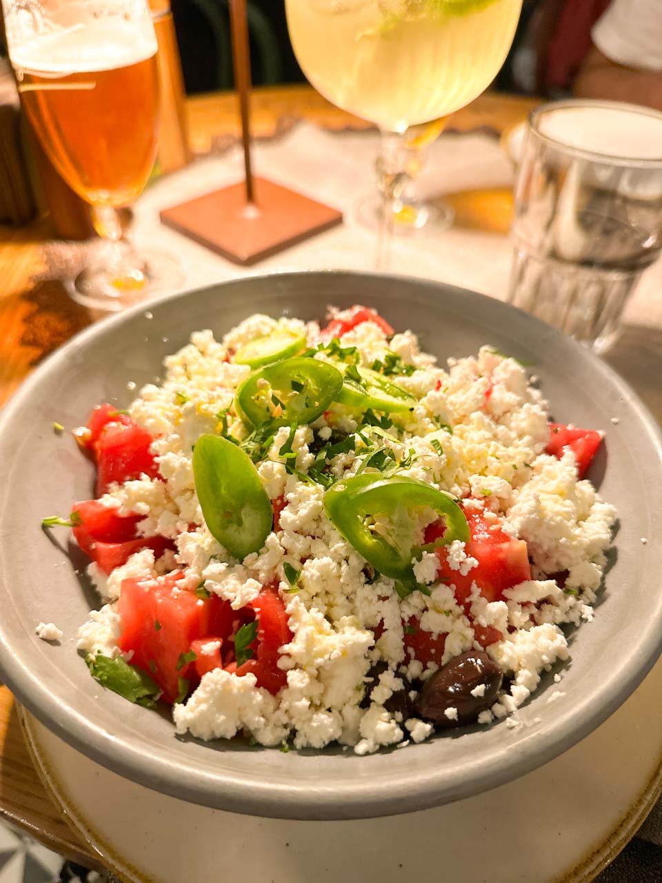 Shopska salad with tomatoes, white cheese, olives, fresh herbs, and green pepper at Shtastlivetsa Restaurant in Sofia